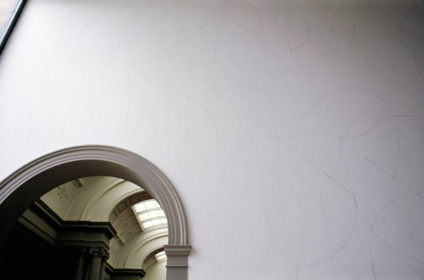 A wall in the Art Gallery of New South Wales entrance court, which features Sol LeWitt’s drawing of simple geometric combinations of arcs, straight lines, not-straight lines and broken lines in four directions.