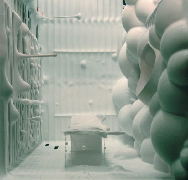 White globular shapes in a constructed white miniature environment